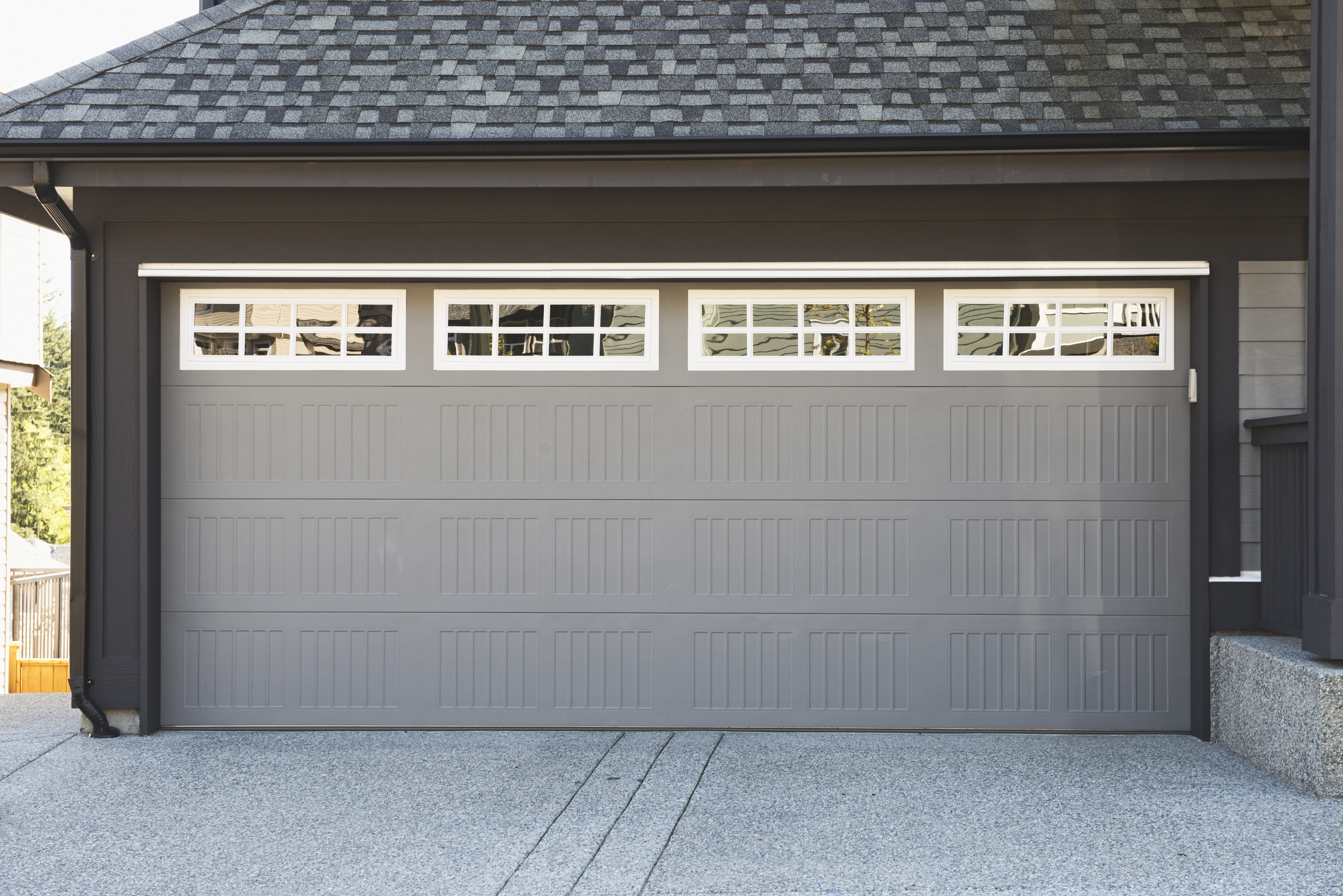 Grey and white garage door with windows