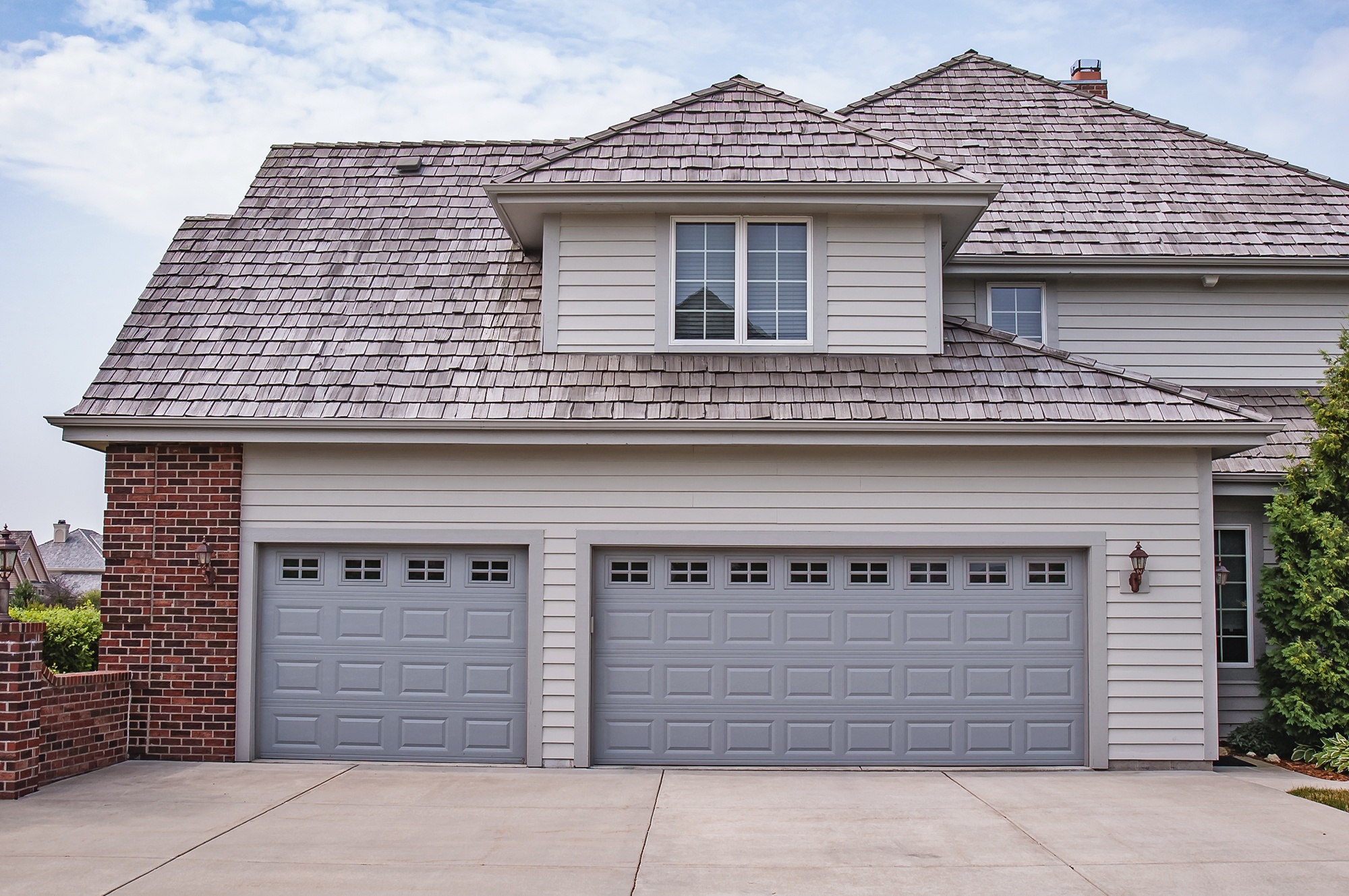 Brand new look of light grey garage door 